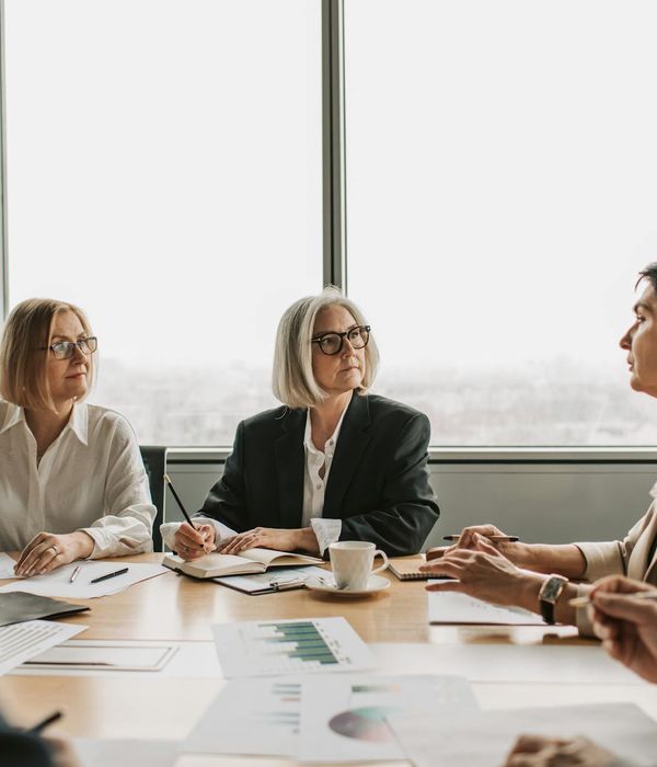 Executive team engaged in strategic planning workshop with collaborative brainstorming